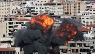 Smoke and flames rise during an Israeli air strike, amid a flare-up of Israeli-Palestinian violence, in Gaza City May 14, 2021. REUTERS/Mohammed Salem