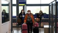 assengers of TUI Airways flight from Dusseldorf arrive at Ioannis Kapodistrias International Airport, as the country's tourism season officially opens, on the island of Corfu, Greece, May 15, 2021. REUTERS/Adonis Skordilis