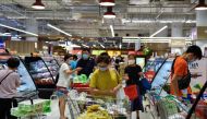 People shop for groceries at a supermarket after curbs on social gatherings and public activities were announced following a rise of coronavirus disease (COVID-19) cases in Singapore May 14, 2021. REUTERS/Caroline Chia