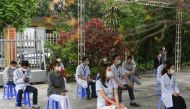 Health workers wait for their turn as Vietnam starts its official rollout of AstraZeneca's coronavirus disease (COVID-19) vaccine for health workers, at Hai Duong Hospital for Tropical Diseases, Hai Duong province, Vietnam. (REUTERS/Thanh Hue/File Photo)