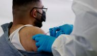 A person receives a vaccine against the coronavirus disease (COVID-19) at a sports hall in Berlin, Germany, May 14, 2021. REUTERS/Axel Schmidt
