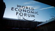 A logo of the 50th World Economic Forum (WEF) annual meeting is pictured on a window in Davos, Switzerland, January 21, 2020. REUTERS/Denis Balibouse/File Photo