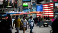 People make their way through Times Square, amid the coronavirus disease (COVID-19) pandemic, in Manhattan, New York City, U.S., May 07, 2021. REUTERS/Eduardo Munoz/File Photo

