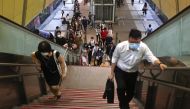 People wear protective face masks while at a metro station, amid a surge in coronavirus disease (COVID-19) infections in Taipei, Taiwan May 18, 2021. REUTERS/Ann Wang