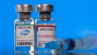 File photo: Vials with Pfizer-BioNTech and Moderna coronavirus disease (COVID-19) vaccine labels are seen in this illustration picture taken March 19, 2021. Reuters/Dado Ruvic/Illustration/File Photo
