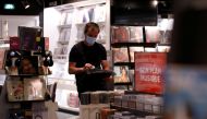 A staff member works during preparations for the reopening of a Fnac store in Paris as part of an easing of the country's lockdown restrictions amid the coronavirus disease (COVID-19) outbreak in France, May 18, 2021. REUTERS/Sarah Meyssonnier