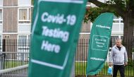 A person walks past a testing centre amid the outbreak of the coronavirus disease (COVID-19), in the Shoreditch area of London, Britain, 18 May 2021. REUTERS/Hannah McKay