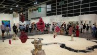 Visitors look at artworks displayed at the Art Basel in Hong Kong, China May 19, 2021. Reuters/Lam Yik