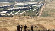 Lebanese soldiers stand in Maroun Al-Ras village, near the border with Israel, in southern Lebanon, May 16, 2021. REUTERS/Aziz Taher