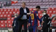 Barcelona's Lionel Messi and coach Ronald Koeman after the match REUTERS/Albert Gea