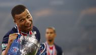  Paris St Germain's Kylian Mbappe celebrates winning the French Cup with the trophy REUTERS/Christian Hartmann