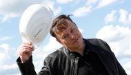 SpaceX founder and Tesla CEO Elon musk holds a helmet as he visits the construction site of Tesla's gigafactory in Gruenheide, near Berlin, Germany, May 17, 2021. REUTERS/Michele Tantussi
