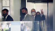 Apple CEO Tim Cook gestures from the elevator as he leaves after speaking during a weeks-long antitrust trial at federal court in Oakland, California, U.S. May 21, 2021. Reuters/Brittany Hosea-Small