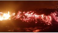 Flowing lava from the volcanic eruption of Mount Nyiragongo, which occurred late on May 22, 2021, is seen in Goma, Democratic Republic of Congo, in this still image from undated video obtained via social media. Enoch David via Reuters