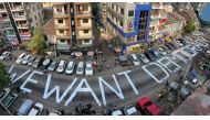 File photo: A slogan is written on a street as a protest after the coup in Yangon, Myanmar February 21, 2021. Reuters/Stringer/File Photo