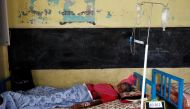A patient suffering from coronavirus disease rests inside a classroom turned Covid-19 care facility on the outskirts of Mumbai, India, May 24, 2021. Reuters/Francis Mascarenhas