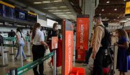 FILE PHOTO: People walk at GOL Airlines check-in area at Guarulhos International Airport amid the outbreak of the coronavirus disease (COVID-19), in Guarulhos, near Sao Paulo, Brazil, May 19, 2020.REUTERS/Amanda Perobelli
