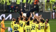 Villarreal players celebrate with coach Unai Emery after winning the Europa League Pool via REUTERS/Maja Hitij