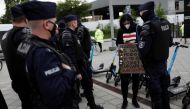 Police check the ID of a woman taking part in a protest against the detention of Belarusian journalist and blogger, Roman Protasevich,  in Gdansk, Poland, May 26, 2021. REUTERS/Kamil Jasinski