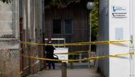 A French gendarme secures the area after an assailant stabbed and badly wounded a policewoman in La Chapelle-sur-Erdre, western France, May 28, 2021. REUTERS/Stephane Mahe