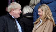Britain's Prime Minister Boris Johnson with his partner Carrie Symonds before the match Reuters/Toby Melville/File Photo