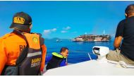 A ferry is seen from a distance during a Barsanas rescue operation after fire broke out on the vessel in North Maluku province, Indonesia, May 29, 2021. Picture taken May 29, 2021. 