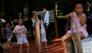 File photo: Children play at an exercise area near Houhai Lake in Beijing, China August 28, 2020.Reuters/Tingshu Wang/File Photo