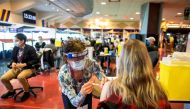 FILE PHOTO: A healthcare worker administers the Pfizer/BioNTech coronavirus disease (COVID-19) vaccine, which was authorized by Canada to be used for children aged 12 to 15, at Woodbine Racetrack pop-up vaccine clinic in Toronto, Ontario, Canada May 5, 20