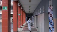 A healthcare worker carries a cooler with vials of vaccines against the coronavirus disease (COVID-19) at a school turned vaccination centre as Ecuador's government launched a plan to vaccinate nine million people in 100 days, in Quito, Ecuador June 1, 20