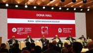 Speakers participating in a panel discussion at the Qatar Pavilion during SPIEF.