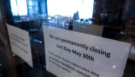 A closed sign is seen at the Chu Chocolate Bar & Cafe, days after it was permanently closed due to the coronavirus disease (COVID-19) pandemic in Bangkok, Thailand, June 1, 2021. Picture taken June 1, 2021. REUTERS/Athit Perawongmetha