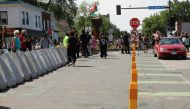 New bike lane safety posts line the street after city employees began to reopen George Floyd Square, the area where George Floyd was killed in Minneapolis police custody the year before, in Minneapolis, Minnesota, U.S., June 3, 2021. REUTERS/Nicole Neri
