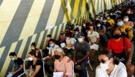 People wait to receive the second dose of Sinovac's COVID-19 vaccine at the Kodang stadium in Bangkok, Thailand June 4, 2021. REUTERS/Athit Perawongmetha
