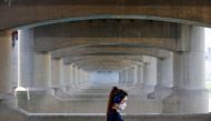 A woman takes a walk at a Han river park amid the coronavirus disease (COVID-19) pandemic, in Seoul, South Korea, June 2, 2021. REUTERS/Kim Hong-Ji