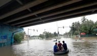 Men float on a tube down a flooded road during a COVID-19 curfew in Kaduwela, a suburb town of Colombo, Sri Lanka June 6, 2021. REUTERS/Dinuka Liyanawatte