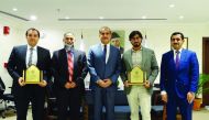 Ambassador of Pakistan to Qatar, H E Syed Ahsan Raza Shah (centre), with the QU graduates and guests.