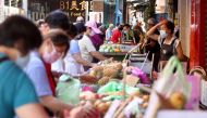 People wearing protective face masks shop at a market amid the coronavirus disease (COVID-19) pandemic, in Taipei, Taiwan, June 8, 2021. REUTERS/Ann Wang
