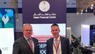 Henk J Hoogendoorn, Managing Director of Financial Sector Office, QFC, with an official during SPIEF.