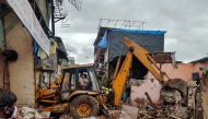 Rescue workers search for survivors in the debris after a residential building collapsed in Mumbai, India, June 10, 2021. REUTERS/Hemanshi Kamani