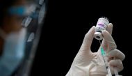 FILE PHOTO: A health worker prepares a dose of AstraZeneca COVID-19 vaccine against the coronavirus disease (COVID-19) as Thailand start mass inoculation at a gymnasium inside Siam Paragon shopping centre, Bangkok, Thailand June 7, 2021. REUTERS/Soe Zeya 