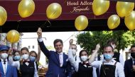 Hotel Director Michael Sorgenfrey poses with employees as they prepare to receive guests at the Hotel Adlon Kempinski after lockdown due to the coronavirus disease (COVID-19) pandemic in Berlin, Germany, June 11, 2021. REUTERS/Michele Tantussi