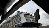 Royal Caribbean's Quantum of the Seas cruise ship docks at Marina Bay Cruise Center after a passenger tested positive for coronavirus disease (COVID-19) during a cruise to nowhere, in Singapore, December 9, 2020. REUTERS/Edgar Su/File Photo