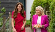 U.S. first lady Jill Biden and Britain's Catherine, Duchess of Cambridge, carry carrots during a visit to Connor Downs Academy, in Hayle, Cornwall, Britain, June 11, 2021. Aaron Chown/Pool via REUTERS