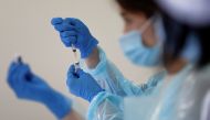 A health worker fills a syringe with a dose of the Pfizer-BioNTech coronavirus disease (COVID-19) vaccine at the Noevir Stadium Kobe, in Kobe, Japan on June 12, 2021. (REUTERS/Issei Kato)
