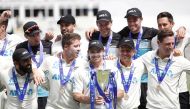 New Zealand's Tom Latham celebrates winning the series with the trophy and teammates Action Images via Reuters/Peter Cziborra