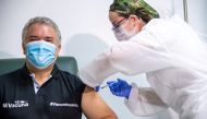 Colombia's President Ivan Duque gets his first shot of the Pfizer-BioNTech COVID-19 vaccine, in Bogota, Colombia June 13, 2021. Colombia Presidency/Handout via REUTERS ATTENTION EDITORS - THIS IMAGE HAS BEEN SUPPLIED BY A THIRD PARTY. NO RESALES. NO ARCHI