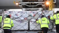 Workers manoeuvre a batch of Johnson & Johnson coronavirus disease (COVID-19) vaccines from the United States after its arrival to the Toluca International Airport, in San Pedro Totoltepec, Mexico June 15, 2021. Mexico's Presidency/Handout via REUTERS 