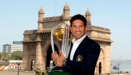 FILE PHOTO: India's Sachin Tendulkar holds the World Cup trophy after India defeated Sri Lanka in the 2011 Cricket World Cup final, in Mumbai April 3, 2011. REUTERS/Philip Brown/File Photo
