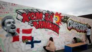 People write get well messages on a wall at a fanzone in Copenhagan after Denmark's Christian Eriksen collapsed on the pitch during his side's Euro 2020 match with Finland Reuters/Hannah Mckay