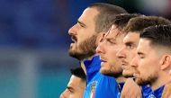 Italy's Lorenzo Insigne, Leonardo Bonucci and Ciro Immobile line up during the national anthems before the match Pool via REUTERS/Alessandra Tarantino